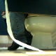 A guy video-records women using the toilet in a Wal-Mart restroom in several scenes. The view is from under the stall wall, so no faces are visible.